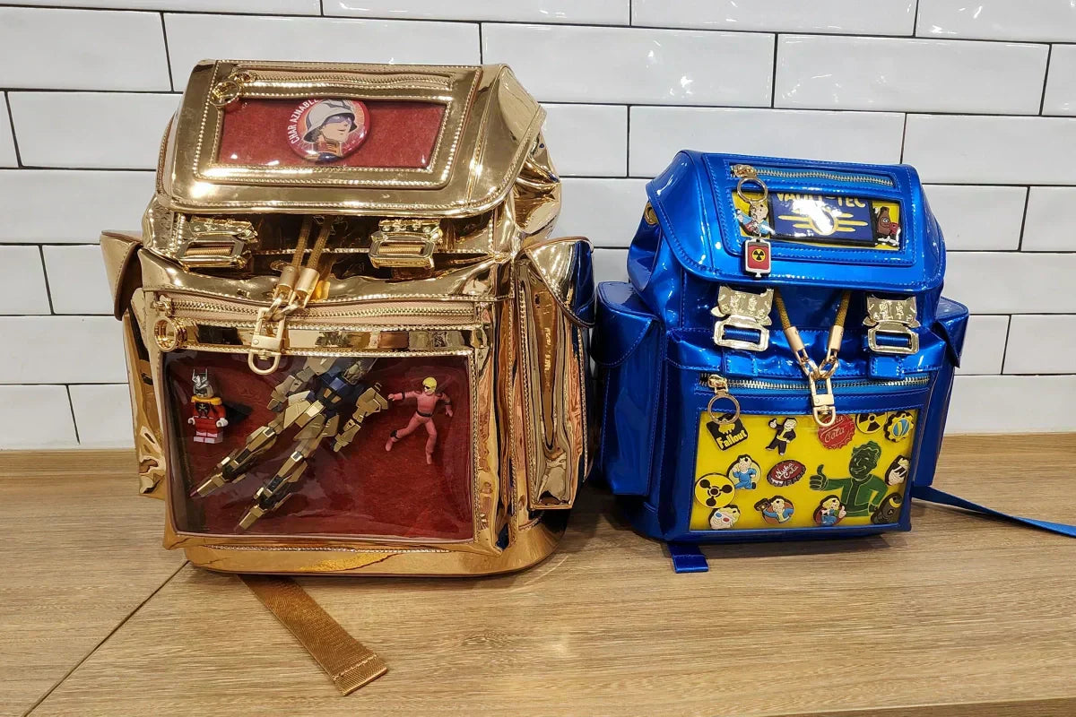 Two Cyberpunk Ita Backpack decorated with anime merch and enamel pins.
