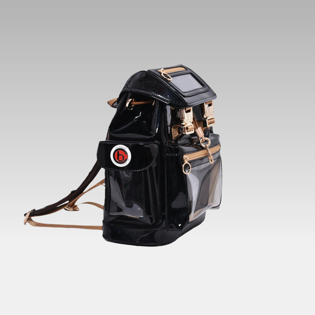 Side profile of the Glossy Black Cyberpunk Ita Backpack Mini featuring the prominent custom hardware emblem.