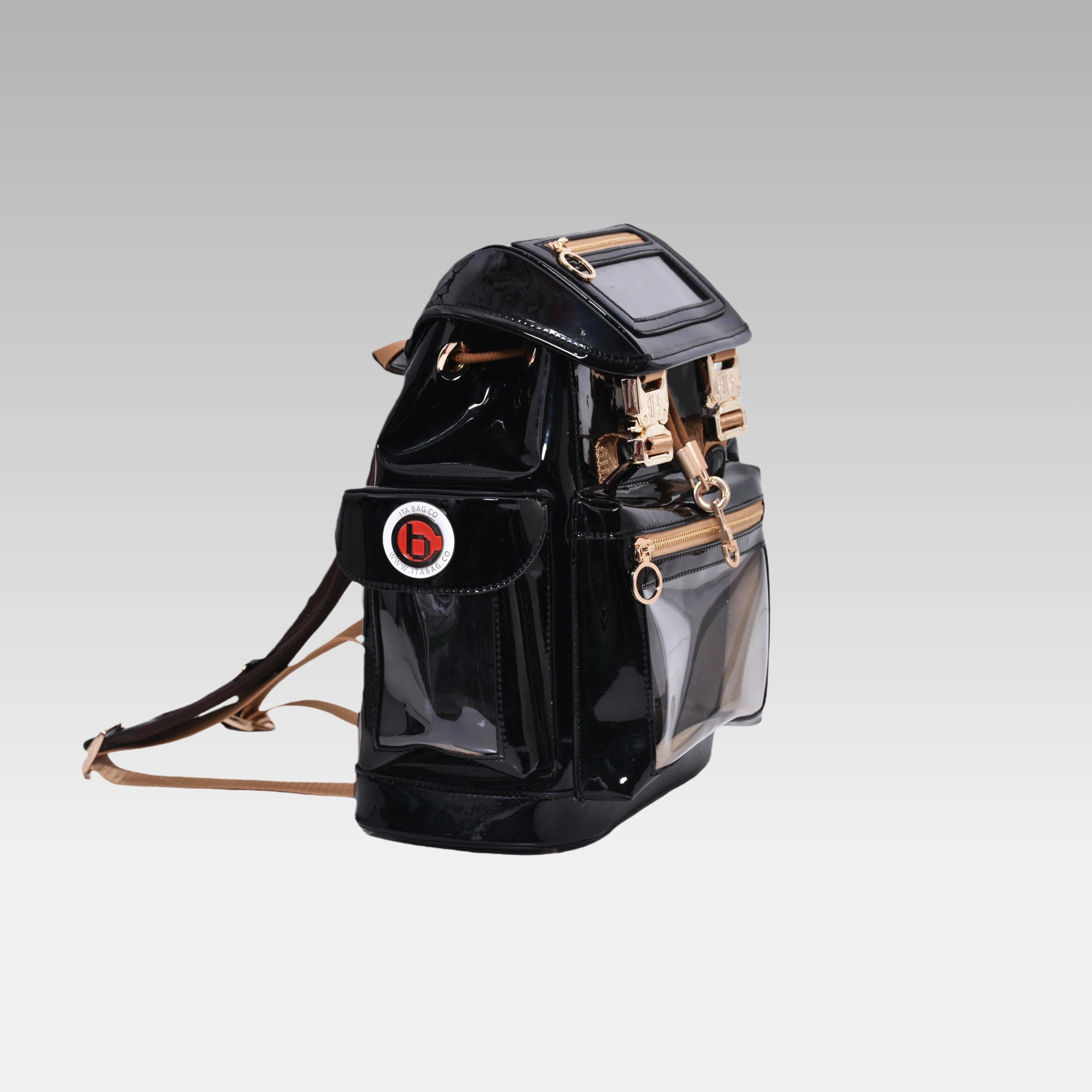 Side profile of the Glossy Black Cyberpunk Ita Backpack Mini featuring the prominent custom hardware emblem.