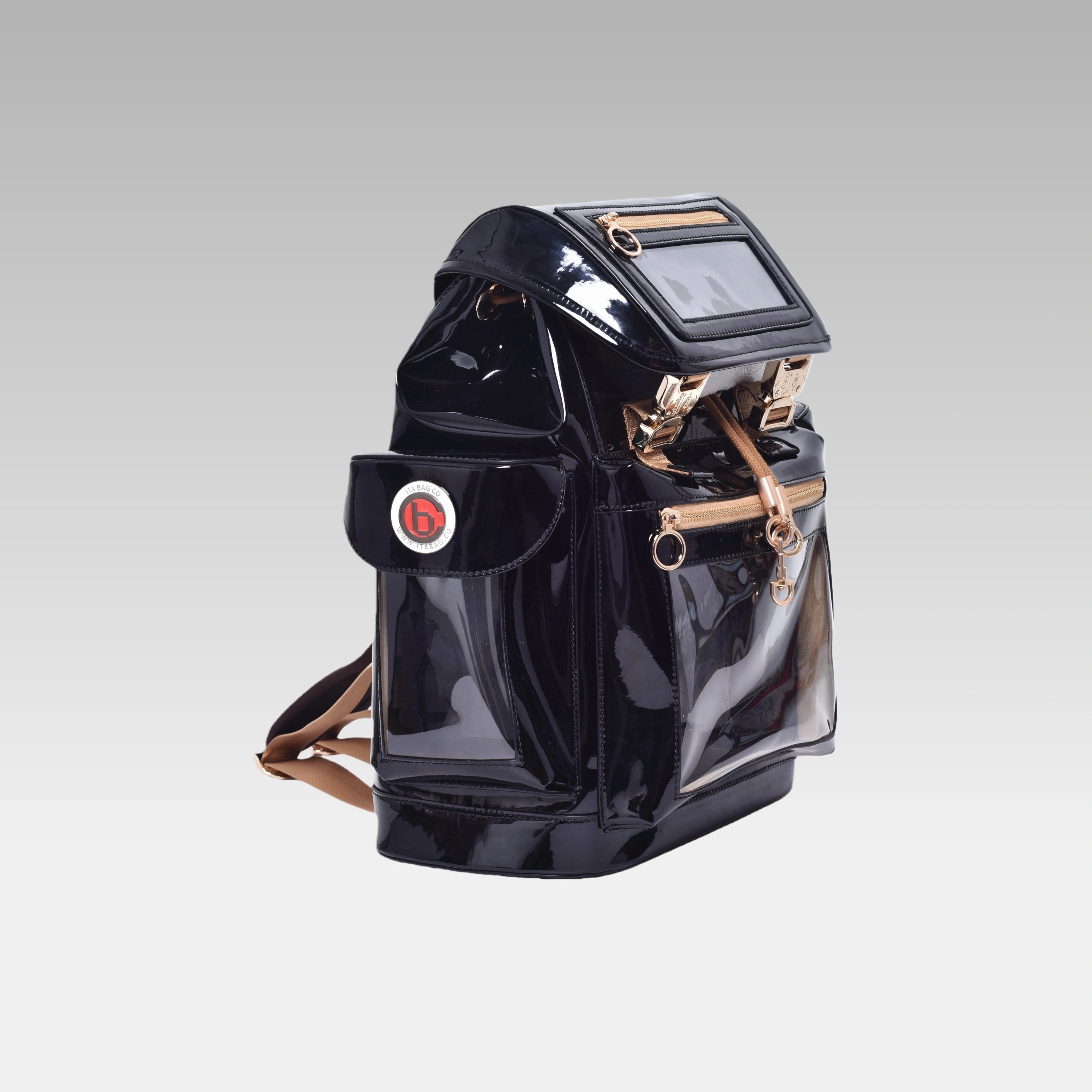 Side profile of the Glossy Black Cyberpunk Ita Backpack featuring the prominent custom hardware emblem.