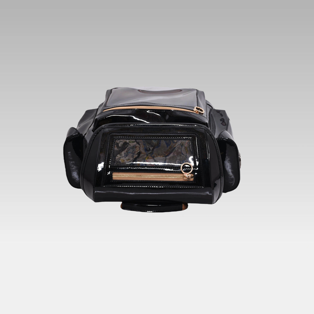 Top-down perspective of the Glossy Black Cyberpunk Ita Backpack, showing the main zipper closures and top handle.