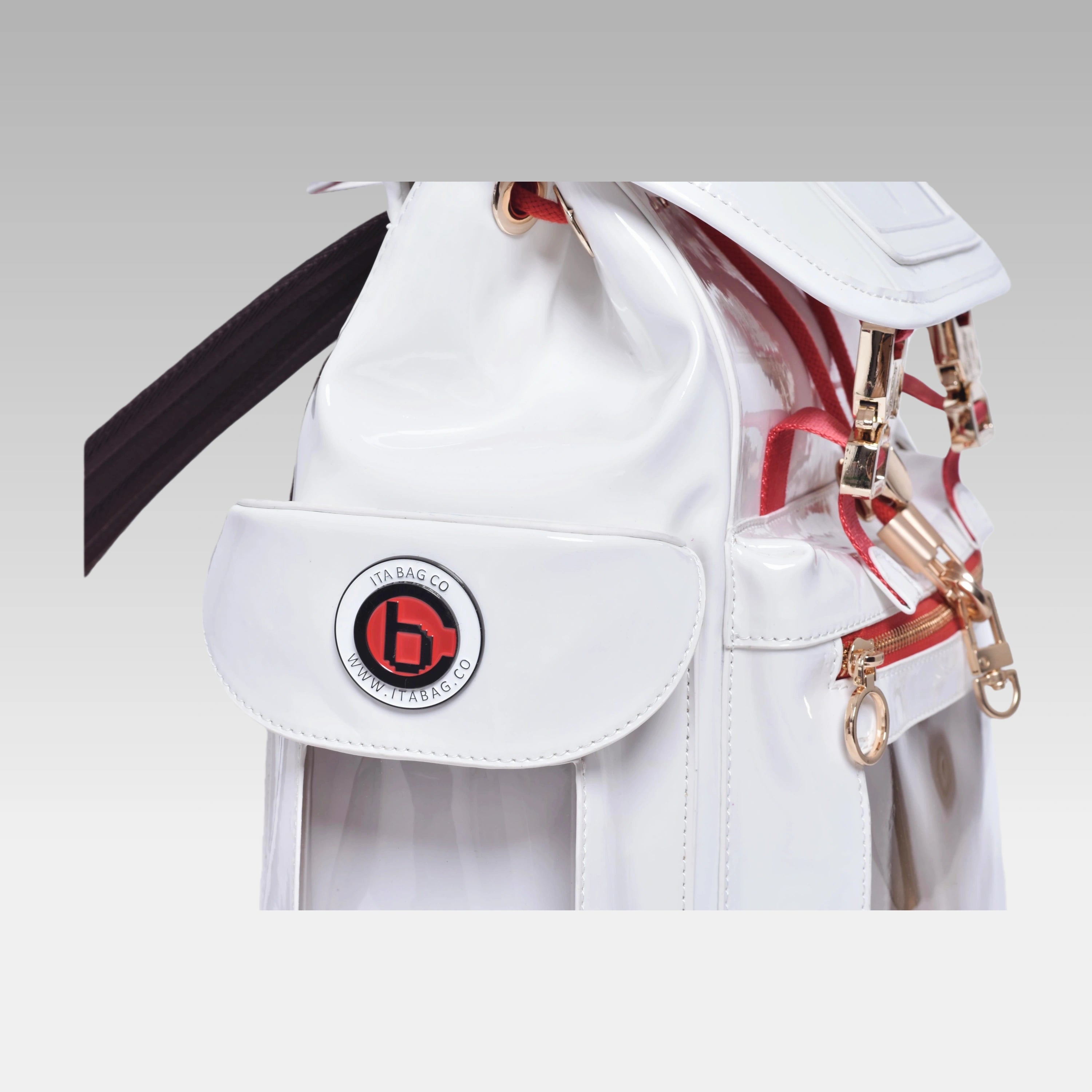 Close-up macro detail of the custom hardware emblem on the Glossy White Cyberpunk Ita Bag.