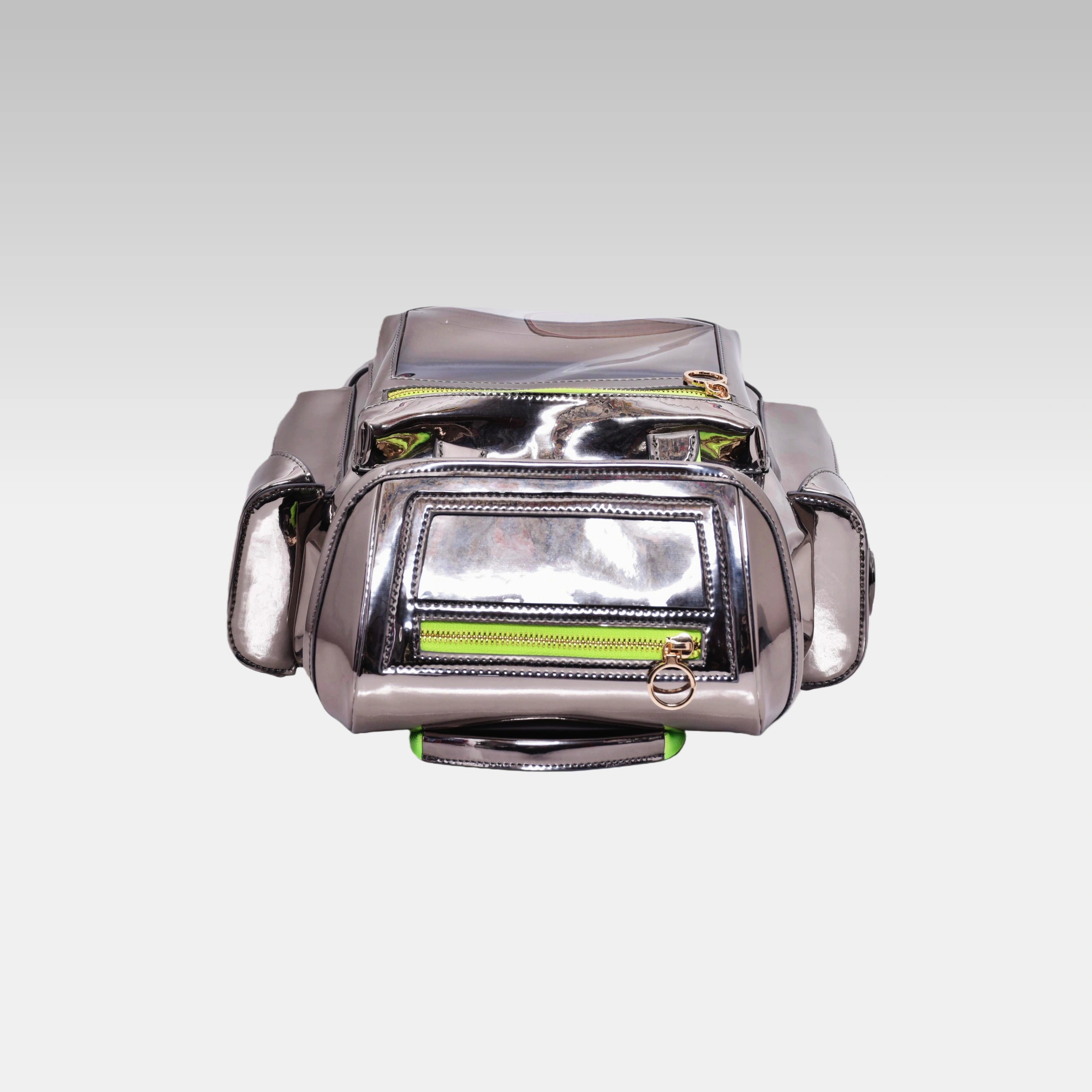 Top-down view of the Metallic Gray Cyberpunk Ita Backpack Mini highlighting the top zipper closures and grab handle.