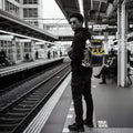 Model wearing the standard Metallic Gray Cyberpunk Ita Backpack, a premium ita bag designed as a sleek cyber goth backpack for pins and plushies.