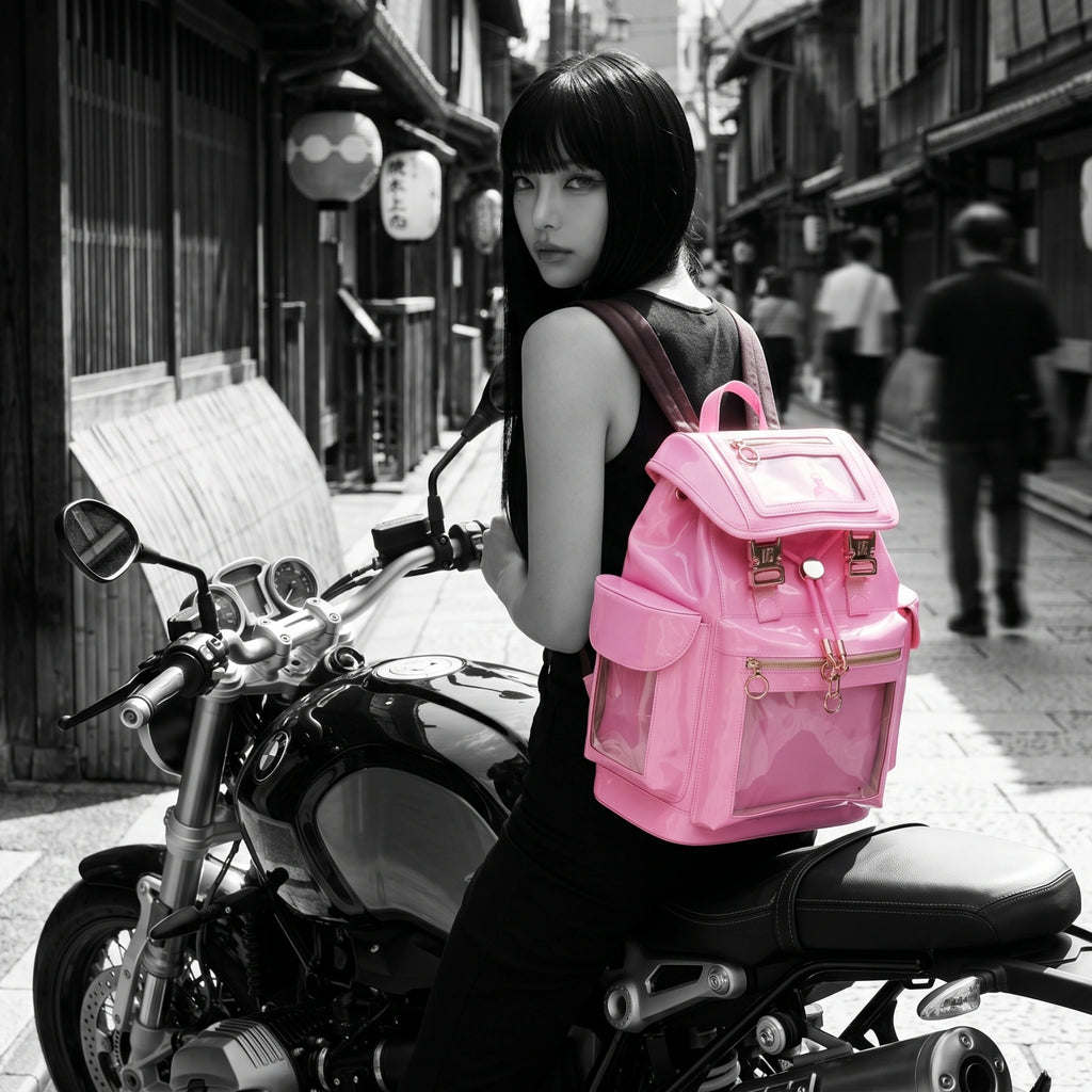 Woman with a pastel pink Cyberpunk Ita Backpack sitting on a motorcycle in an urban setting.