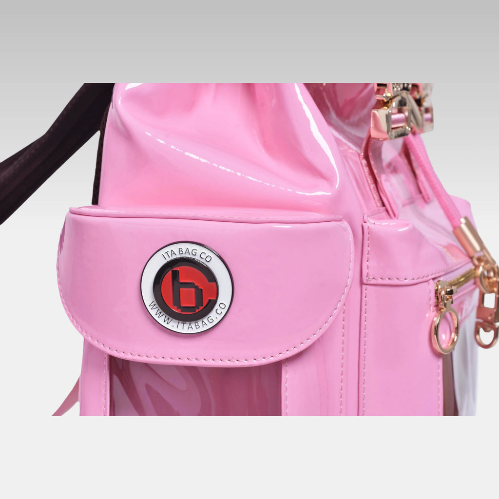 Close-up macro detail of the custom hardware emblem on the Pastel Pink Cyberpunk Ita Bag.