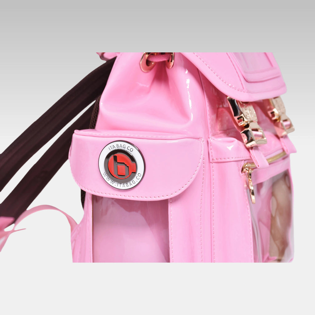 Close-up macro detail of the custom hardware emblem on the Pastel Pink Cyberpunk Ita Bag Mini.