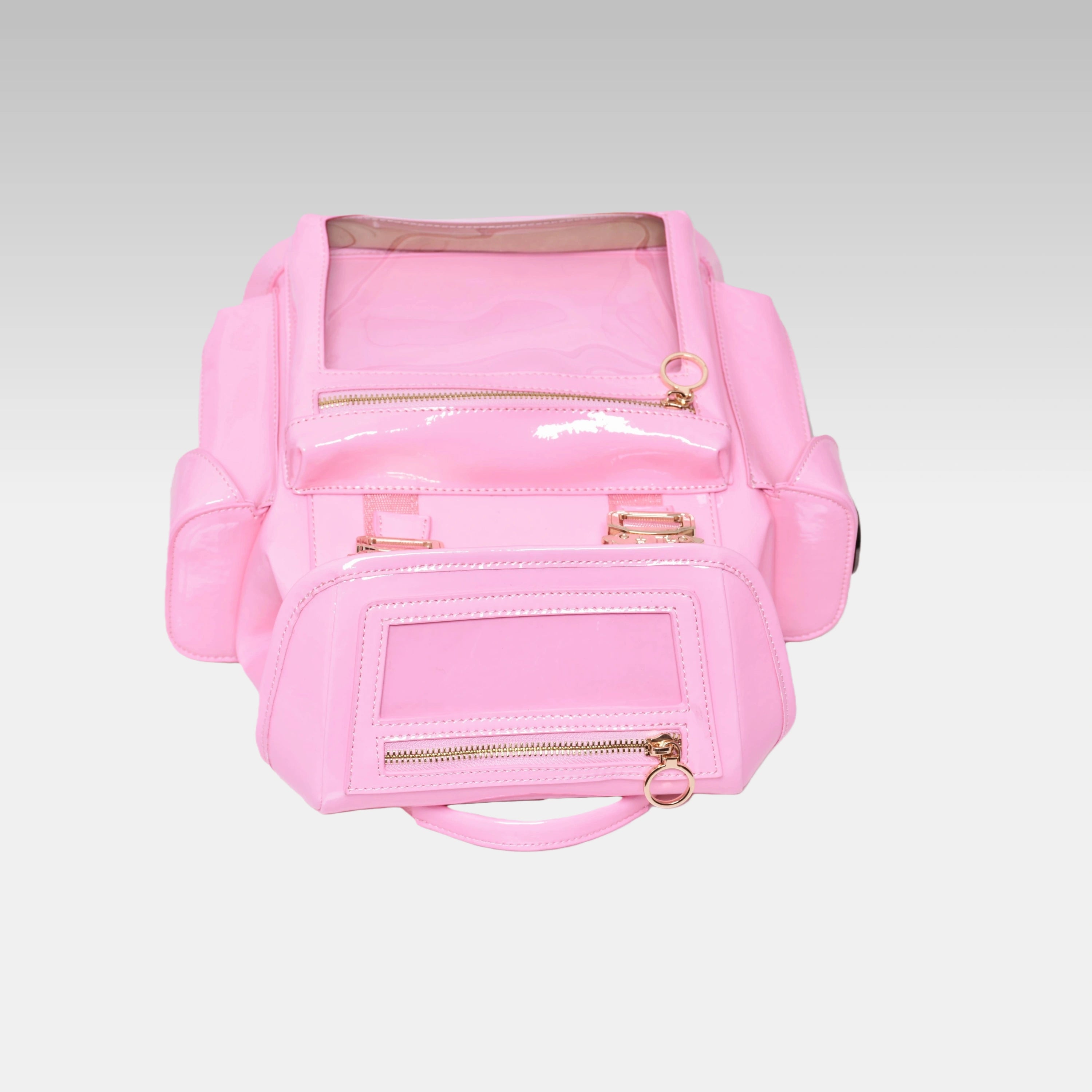 Top-down view of the Pastel Pink Cyberpunk Ita Backpack Mini highlighting the grab handle and top zipper closures.