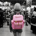 Model wearing the standard Pastel Pink Cyberpunk Ita Backpack, a kawaii backpack and cute pink ita bag engineered specifically as a backpack for pins.