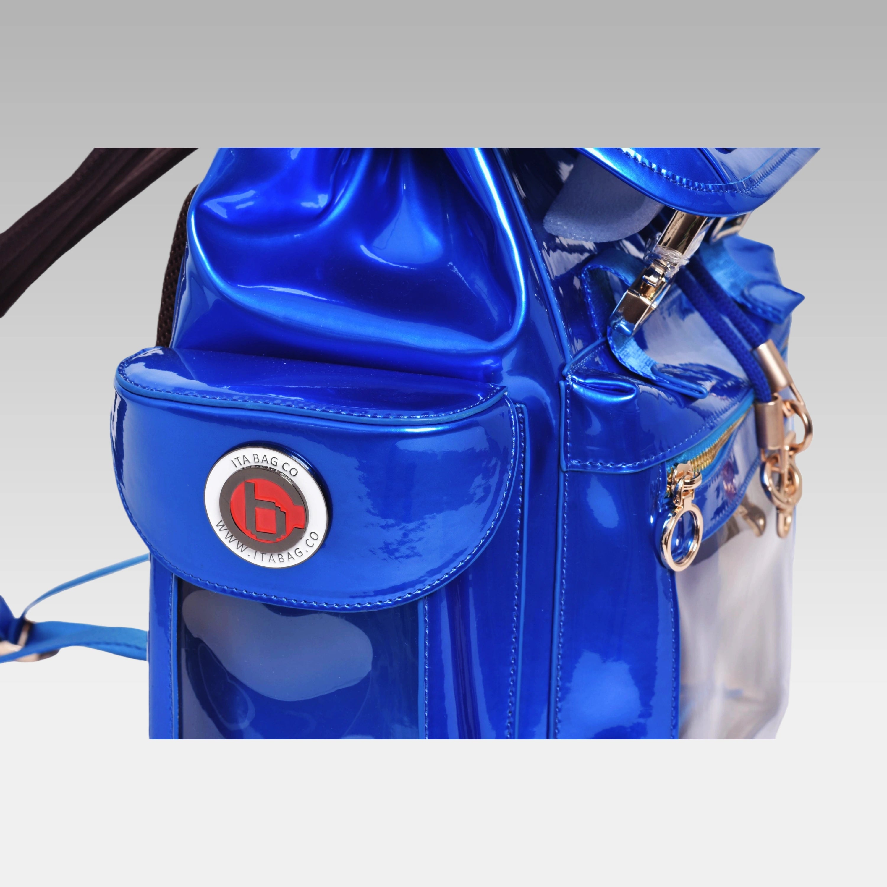 Close-up macro detail of the custom hardware emblem on the standard Quantum Blue Cyberpunk Ita Bag.