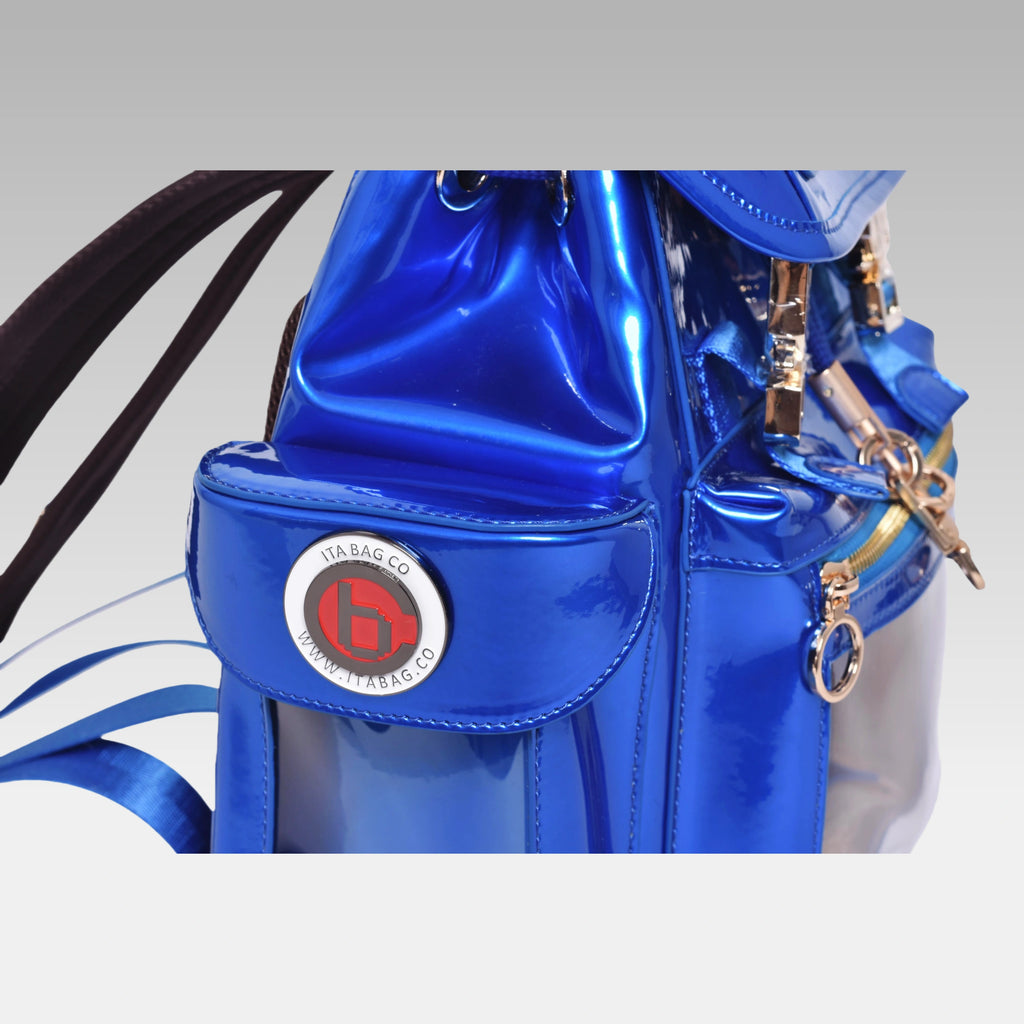 Close-up detail of the custom hardware emblem on the Quantum Blue Cyberpunk Ita Bag Mini.