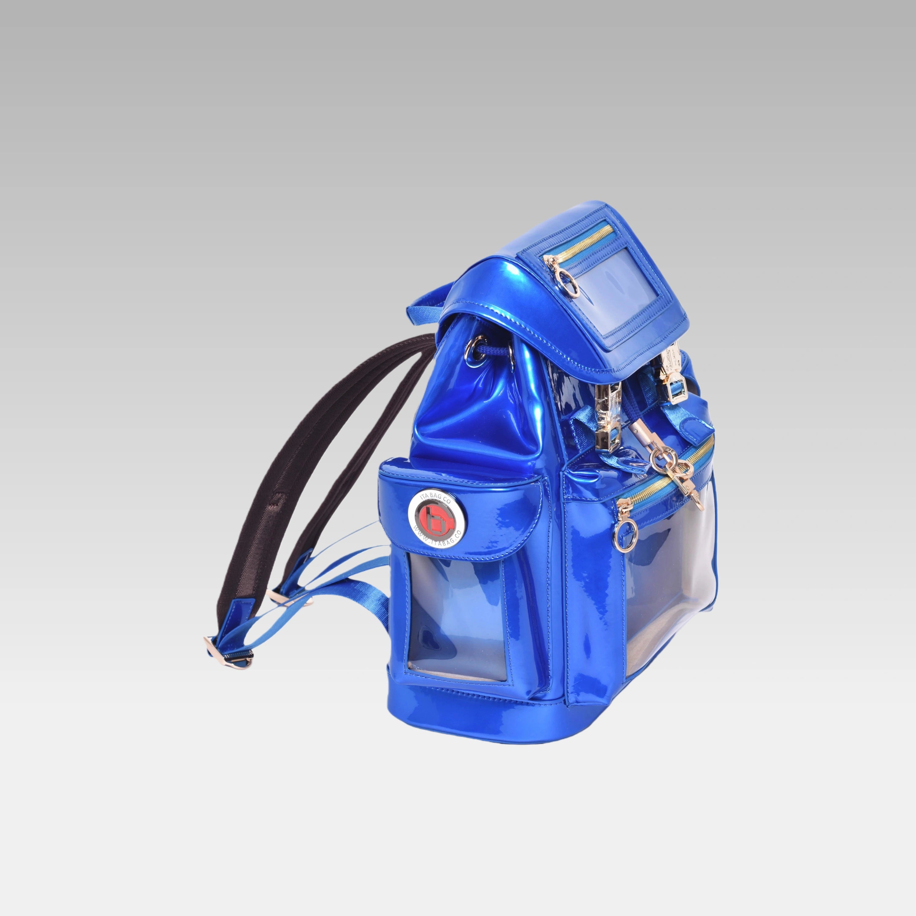 Side profile of the Quantum Blue Cyberpunk Ita Backpack Mini featuring the custom hardware emblem.