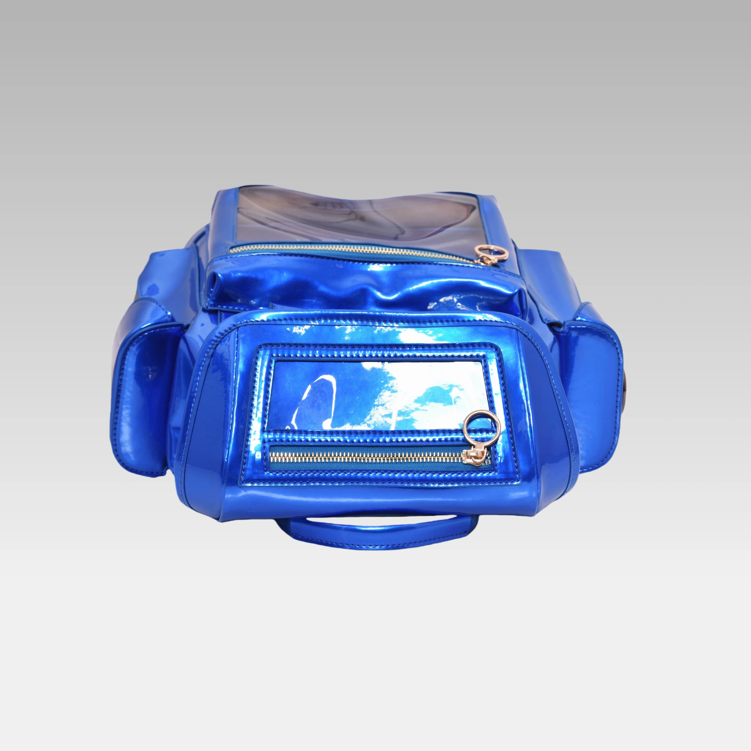 Top-down view of the Quantum Blue Cyberpunk Ita Backpack Mini highlighting the grab handle and top zipper closures.