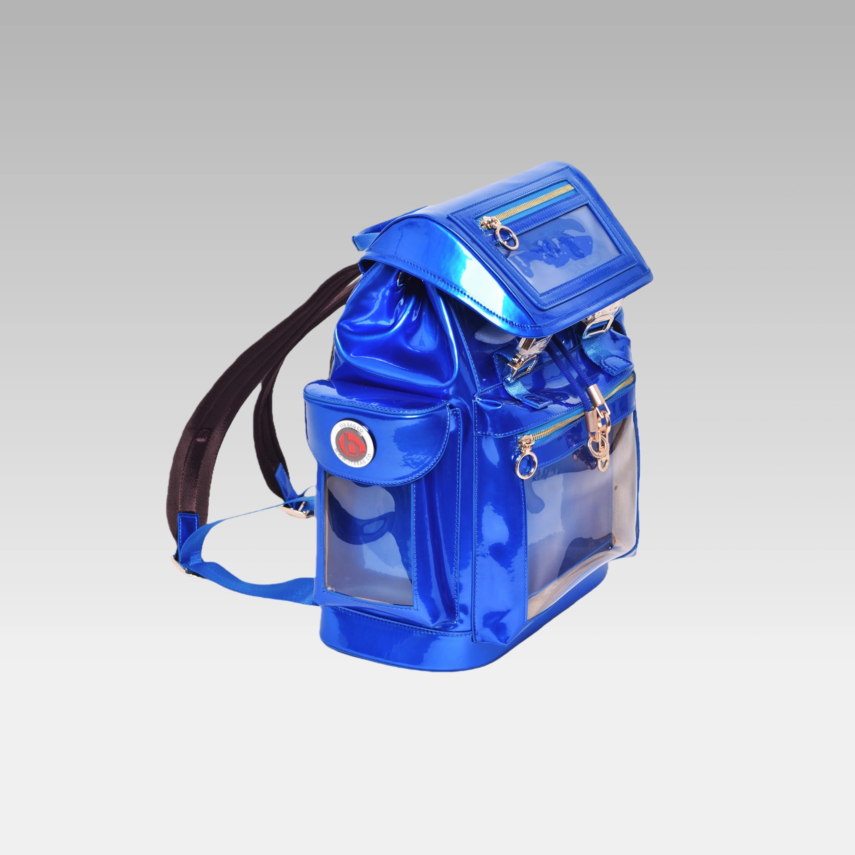Side profile of the standard Quantum Blue Cyberpunk Ita Backpack featuring the custom hardware emblem.